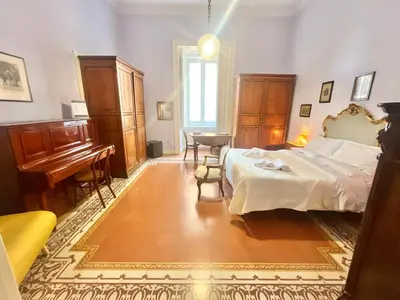 Letto o letti in una camera di Conservatorio 16 Rooms centro storico