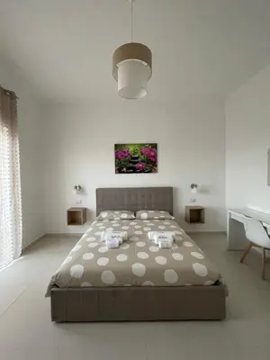 Letto o letti in una camera di Casa Langellotti plus