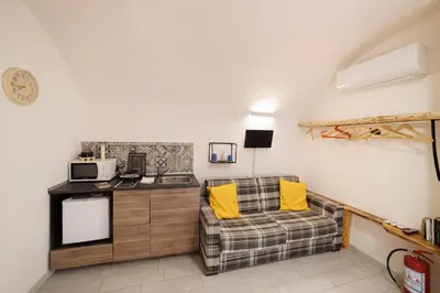 Cucina o angolo cottura di LegnoSuites 3 rooms 3 bathrooms Group and Family By HouseinNaples